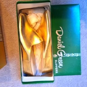 Brand new Daniel Green gold slipper never worn